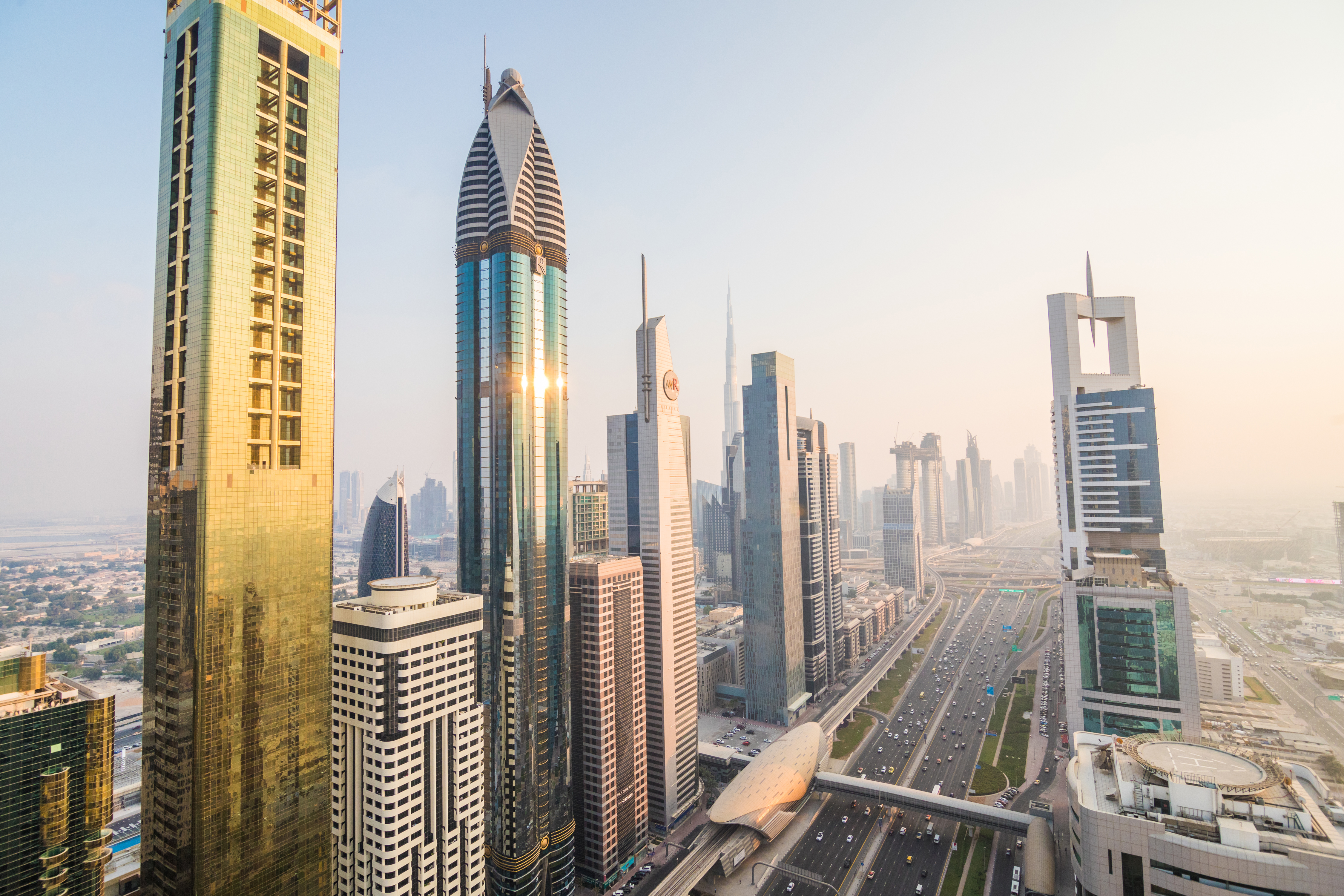 Dubai, UAE - October, 2018. Dubai skyline and downtown skyscrapers on sunset. Modern architecture concept with highrise buildings on world famous metropolis in United Arab Emirates